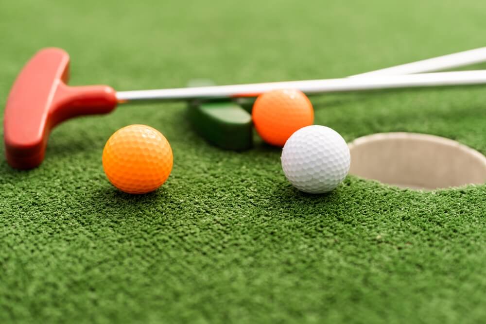 closeup of mini golf clubs in Wisconsin Dells